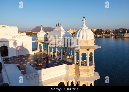 Morning view over the 5 star Taj Lake Palace Hotel on Jag Niwas Island on Lake Pichola, Udaipur, Indian state of Rajasthan on a sunny day Stock Photo