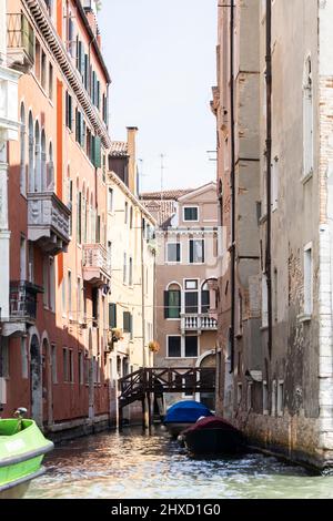 View into a small canal in the old town of Venice, Italy Stock Photo