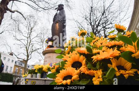 London, UK. 11th March 2022. Sunflowers have been planted around the statue of St Volodymyr, the ruler of Ukraine from 980-1015, in Holland Park, alongside signs in support of Ukraine. Sunflowers have become symbols of Ukrainian resistance and solidarity  during the Russian attack. Credit: Vuk Valcic/Alamy Live News Stock Photo