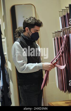 Milan, . 11th Mar, 2022. Milan, 11-03-2022 Tommaso Zorzi with a friend goes to the 'Hermes' boutique in via Montenapoleone to buy a tie to give as a gift. His friend who accompanies him helps him in his choice, then when they leave they walk home. Credit: Independent Photo Agency/Alamy Live News Stock Photo