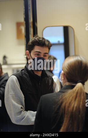 Milan, . 11th Mar, 2022. Milan, 11-03-2022 Tommaso Zorzi with a friend goes to the 'Hermes' boutique in via Montenapoleone to buy a tie to give as a gift. His friend who accompanies him helps him in his choice, then when they leave they walk home. Credit: Independent Photo Agency/Alamy Live News Stock Photo