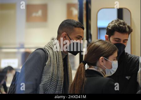 Milan, . 11th Mar, 2022. Milan, 11-03-2022 Tommaso Zorzi with a friend goes to the 'Hermes' boutique in via Montenapoleone to buy a tie to give as a gift. His friend who accompanies him helps him in his choice, then when they leave they walk home. Credit: Independent Photo Agency/Alamy Live News Stock Photo