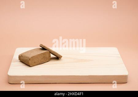 hashish large portion on wood with space for text, brown background Stock Photo