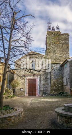 The church of Saint Martin in Aigne was built in the XI century in Roman style and is equipped with 3 Gothic bells. The old village center has the shape of a snail shell and was also built in the XI century (also called L'Escargot). Monument historique. Stock Photo
