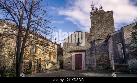 The church of Saint Martin in Aigne was built in the XI century in Roman style and is equipped with 3 Gothic bells. The old village center has the shape of a snail shell and was also built in the XI century (also called L'Escargot). Monument historique. Stock Photo