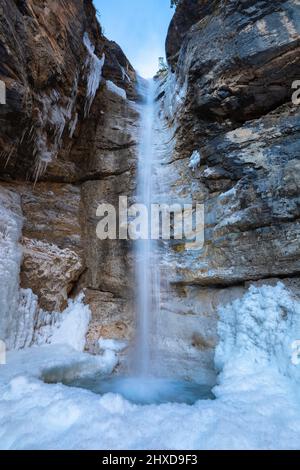 Europe, Italy, Veneto, province of Belluno, Taibon Agordino, small waterfall in Corpassa valley in winter season Stock Photo