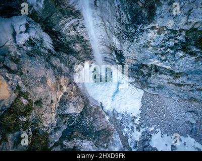 Europe, Italy, Veneto, province of Belluno, Taibon Agordino, small waterfall in Corpassa valley in winter season Stock Photo