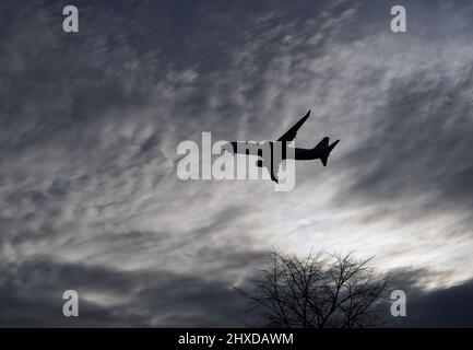 Airplane approaching its destination Stock Photo