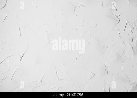 Irregular white plaster texture applied with a spatula on a wal Stock Photo