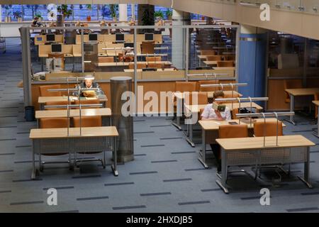 Minsk, Belarus - December 31, 2017: People reading books in the national library of the Republic of Belarus Stock Photo