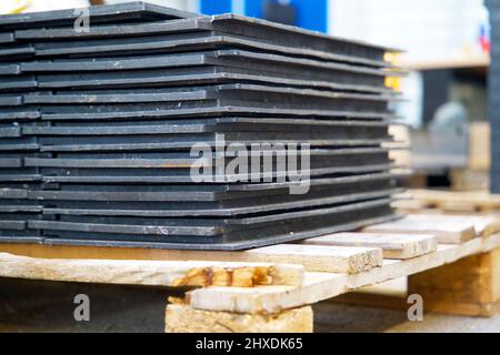 Pile of recycled plastic construction material made from restmix waste plastics on a recycling plant Stock Photo
