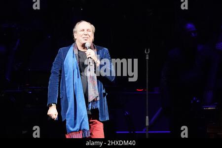 Hamburg, Germany. 11th Mar, 2022. German film composer Hans Zimmer welcomes the audience on stage at Barclays Arena. Oscar winner Zimmer has started his 'Hans Zimmer Live - Europe Tour' together with the Odessa Orchestra in the Hanseatic city. Credit: Marcus Brandt/dpa/Alamy Live News Stock Photo