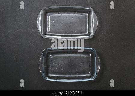 A baking dish cleaned from a thick layer of carbon. Glassware for baking after washing with a steam cleaner. Stock Photo