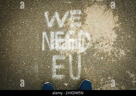 Written statement on the ground 'we need EU'. Integration process to EU concept Stock Photo