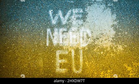 Written statement on the ground 'we need EU'. Ukraine Integration process to EU concept and solidarity in Europe. Stand with Ukraine. STOP WAR concept Stock Photo