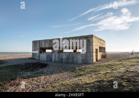 Second world war pillbox on Rye Harbour beach, East Sussex, England, on a sunny winter day Stock Photo