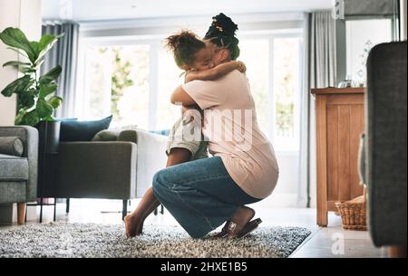 Hug it out. Shot of a mother and child hugging at home. Stock Photo