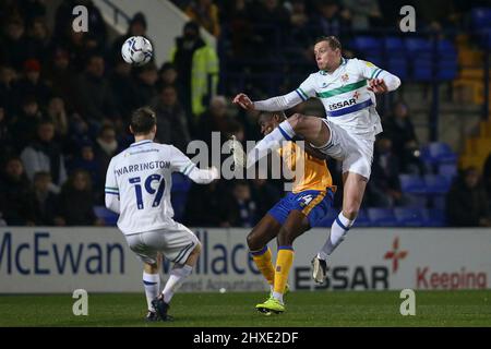 Birkenhead, UK. 11th Mar, 2022. Tom Davies of Tranmere Rovers jumps for the ball. EFL Skybet Football league two match, Tranmere Rovers v Mansfield Town at Prenton Park, Birkenhead, Wirral on Friday 11th March 2022. this image may only be used for Editorial purposes. Editorial use only, license required for commercial use. No use in betting, games or a single club/league/player publications.pic by Chris Stading/Andrew Orchard sports photography/Alamy Live News Credit: Andrew Orchard sports photography/Alamy Live News Stock Photo