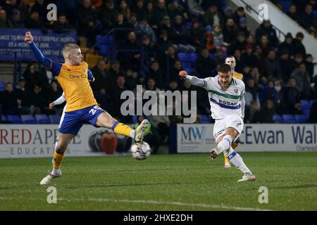 Birkenhead, UK. 11th Mar, 2022. Kieron Morris of Tranmere Rovers (r) shoots at goal. EFL Skybet Football league two match, Tranmere Rovers v Mansfield Town at Prenton Park, Birkenhead, Wirral on Friday 11th March 2022. this image may only be used for Editorial purposes. Editorial use only, license required for commercial use. No use in betting, games or a single club/league/player publications.pic by Chris Stading/Andrew Orchard sports photography/Alamy Live News Credit: Andrew Orchard sports photography/Alamy Live News Stock Photo