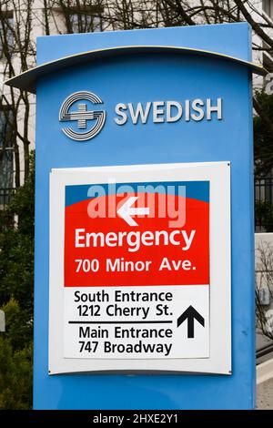 Seattle, WA, USA - March 06, 2022; Pedestal sign with directions and logo for Swedish Medical Center in Seattle Stock Photo