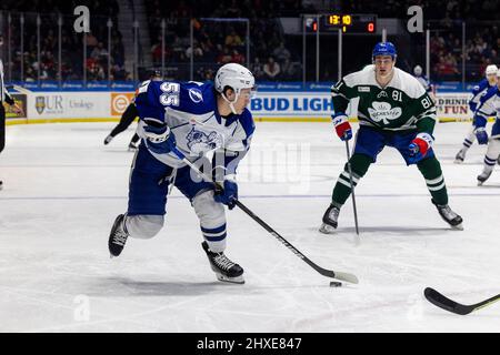 March 11, 2022: Syracuse Crunch forward Charles Hudon (55) skates with the puck into the Rochester Americans zone in the first period. The Rochester Americans hosted the Syracuse Crunch on Irish Night in an American Hockey League game at the Blue Cross Arena in Rochester, New York. (Jonathan Tenca/CSM) Stock Photo