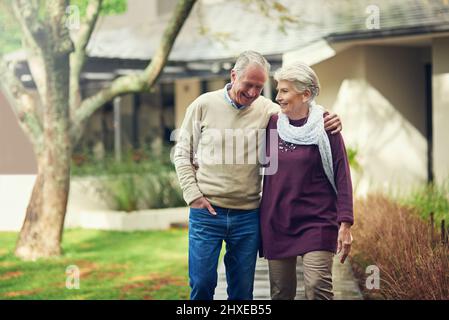 Joyful moments. Shot of a loving senior couple taking a walk outside. Stock Photo