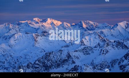 Winter sunset from the Pic du Midi de Bigorre observatory (Pyrenees, France). In the background, Posets peak, in Aragon (Spain) Stock Photo