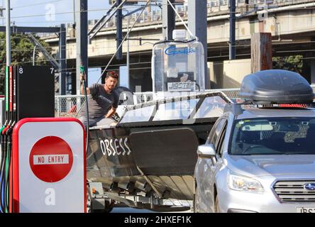 (220312) -- WELLINGTON, March 12, 2022 (Xinhua) -- A man fills in the tank of his boat a Waitomo gas station in New Zealand's capital city Wellington in the afternoon of March 11, 2022, moment before another hike of fuel price. Cars, boats and gallon bottles, New Zealanders were filling every tank with fuel before another big price hike tipped at the weekend. Petrol prices have already jumped up dramatically over the past month, which saw national average price of 91 petrol increase 11.8 percent to 2.94 New Zealand dollars per litre, and 23.1 percent increase for diesel to 2.28 New Zealand d Stock Photo