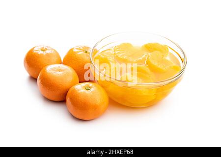 Canned tangerine. Pickled mandarin fruit isolated on white background. Stock Photo