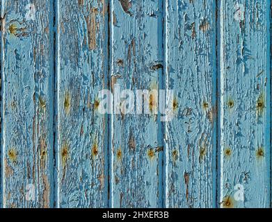 Vertical strips of wood with cracked and peeling blue paint Stock Photo
