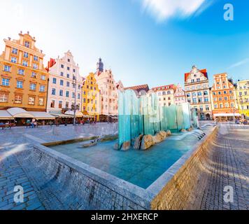 Fantastic view of the ancient homes on a sunny day. Gorgeous and picturesque scene. Location famous Market Square in Wroclaw, Poland, Europe. Historic Stock Photo