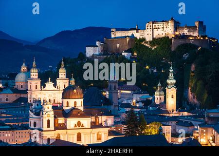 Great  view from the top on an evening city shining in the lights. Dramatic scene. Location famous place (unesco heritage) Festung Hohensalzburg, Salz Stock Photo