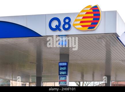 Fossano, Italy - March 11, 2022: Q8 logo sign with euro fuel prices display with high values for oil price increase, gas station of Kuwait Petroleum I Stock Photo