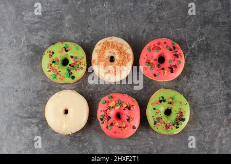 Assorted Doughnut with Colorful Sprinkle Isolated on Grey Cement Background, Copy Space for Text Stock Photo