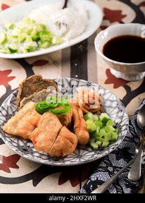 Pempek is Fish and Tapioca Served with Sweet and Sour Kuah Cuka (Cuko) or Vinegar Sauce. This Dish Popular from Palembang, Indonesia Stock Photo