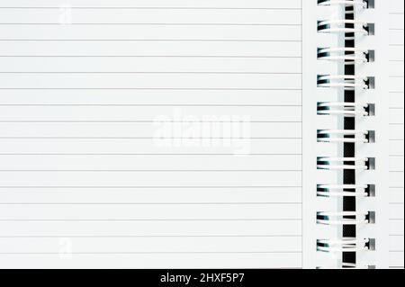 An open spiral notebook with blank page. Stock Photo