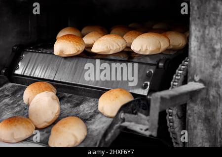 Pita bread in oven Stock Photo - Alamy