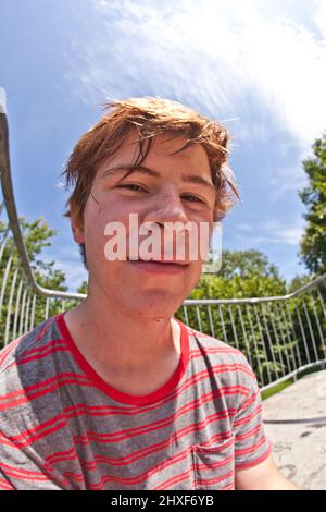 young boy sweating and exhausted from sports Stock Photo