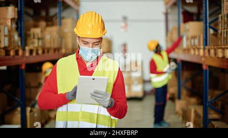 Factory worker using tablet Stock Photo