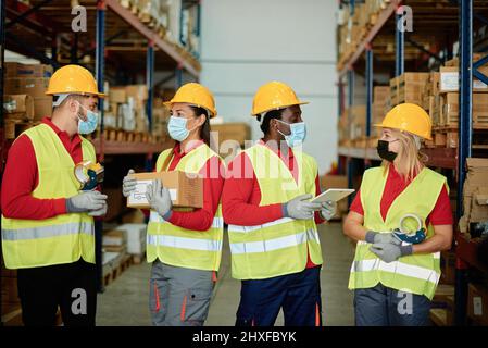 Construction engineers with tablet in warehouse Stock Photo