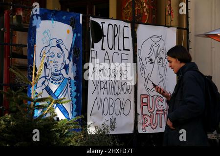 Non Exclusive: LVIV, UKRAINE - MARCH 11, 2022 - Posters are pictured in central Lviv, western Ukraine. Stock Photo