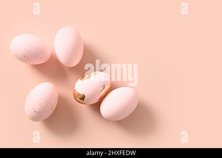 Pink pastel eggs on pink monochrome background. Flat lay. Happy Easter minimalist greeting card with copy space. Top view. Concept eggs dyeing, Stock Photo