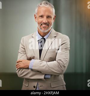 I turned my passion into profit. Portrait of a confident businessman in the office. Stock Photo