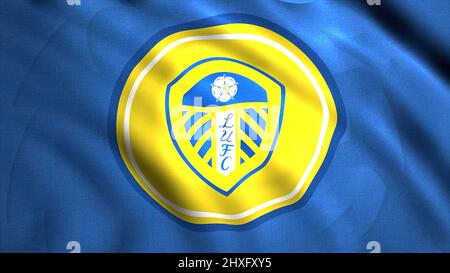 Animated logo of West Yorkshire football club Leeds United. Motion. Yellow round shaped emblem on blue waving background. For editorial use only. Stock Photo