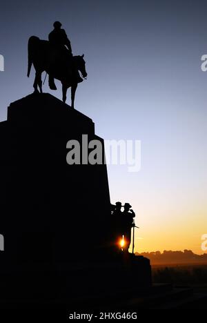 The sun peaks through the Virginia Regiment Memorial on the grounds of Gettysburg National Battlefield Stock Photo