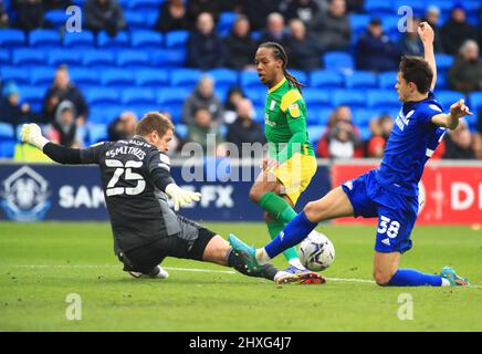 12th March 2022 ; Cardiff City Stadium, Cardiff, Wales; Championship football, Cardiff City versus PNE ; Daniel Johnson of Preston North End's shot is saved by Alex Smithies of Cardiff City outstretched leg Stock Photo