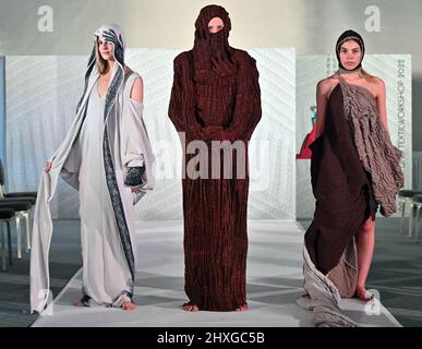 12 March 2022, Thuringia, Apolda: Models show designs by young designer Margitta Volkov from the Weißensee Kunsthochschule Berlin at a fashion show. This year, 16 students from universities in Trier and Berlin took part in the traditional knitting workshop in Apolda. Within a week, they were able to implement their designs in six regional knitting companies and produce their own collections. The collections of the now 20th knitting and textile workshop are to be on display, among other things, on July 2, 2022, at the fashion night on Apolda's market square. Photo: Martin Schutt/dpa-Zentralbild Stock Photo