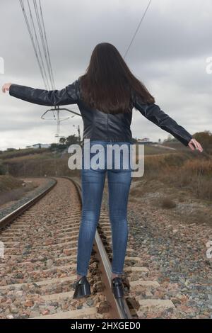 Woman Rails A daring and beautiful woman balancing on train rails Stock Photo - Alamy