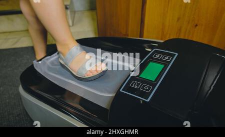 Automatic Thermal Shrinkable Shoe Cover Laminating Machine. Clos