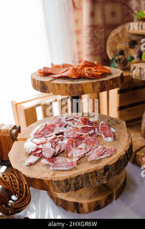 https://l450v.alamy.com/450v/2hxgr6w/slicing-different-types-of-meat-meat-snacks-on-the-table-wedding-buffet-2hxgr6w.jpg
